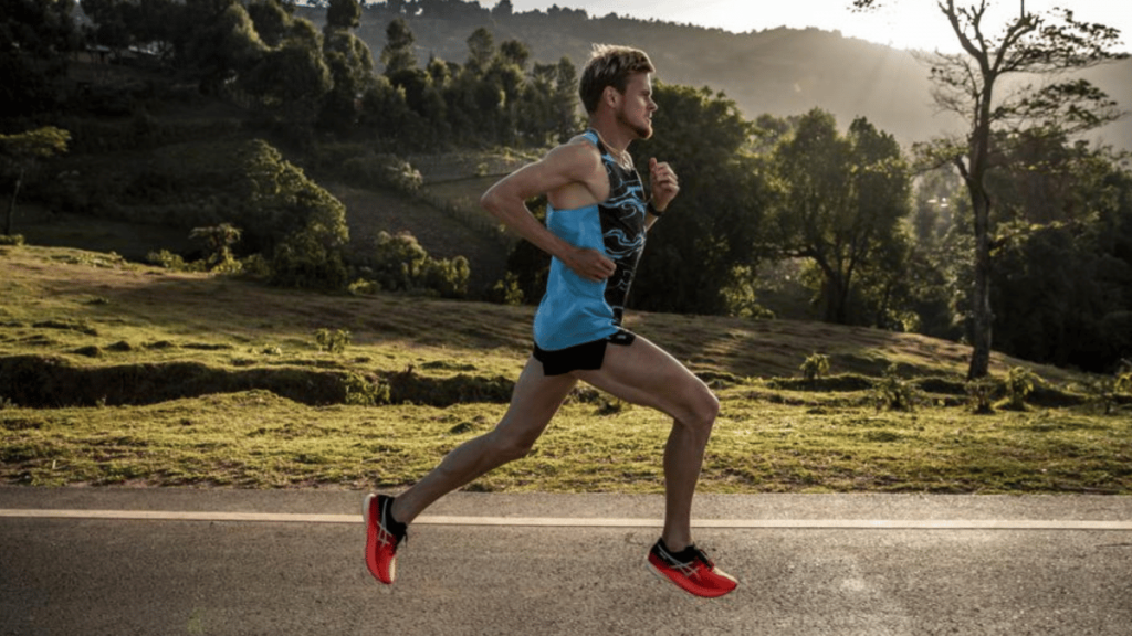 an image of a man running in Asics shoes