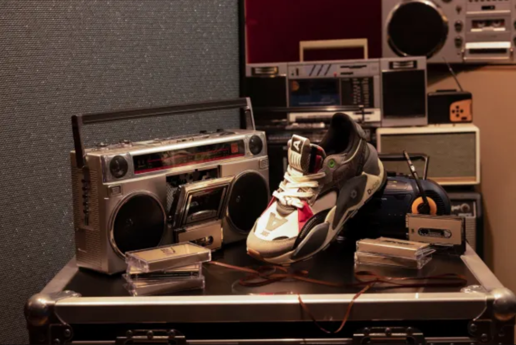 PUMA and Roc Nation Revolutionize Sneaker Culture image of PUMA x Roc Nation sneakers near a record player