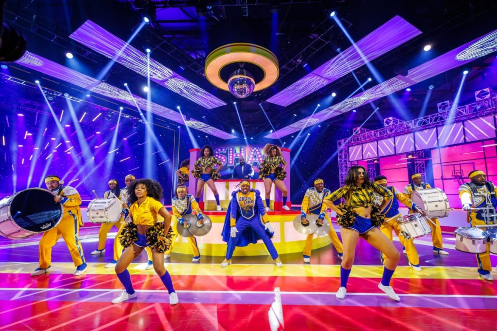 Shaquille O’Neal Will Host The Meta VR New Years Party Rows of people dance on stage in support of a Shaq New Years for Meta.